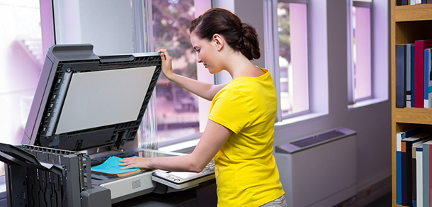 student at photocopier