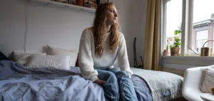 Depressed student on bed
