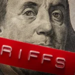 Dollar with tariff sticker on it