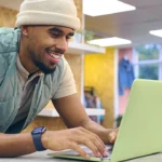 Student working at computer at counter