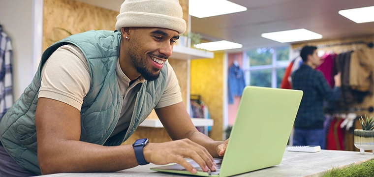 Student working at computer at counter