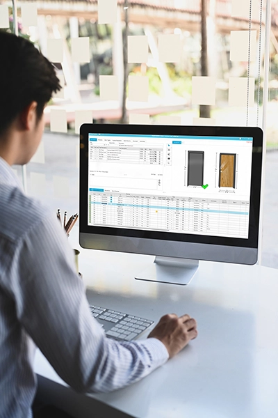 Man working with ASSA ABLOY's Openings Studio software solution