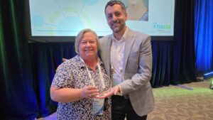 Janet Rauhe, Elon University, receives the 2026 NACCU J. Paul Melanson Award